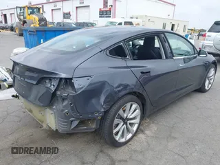 2018 Tesla Model 3 Long Range Battery with VIN 5YJ3E1EA8JF059385, listed as a IAAI auction lot 42116589 with 63,630 mi miles and . Bid and sale history available at DreamBid. Image 4.
