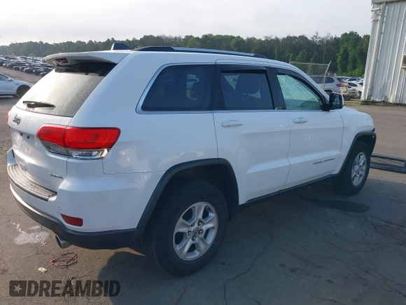 2016 Jeep Grand Cherokee Laredo with VIN 1C4RJFAG0GC324917, listed as a IAAI auction lot 42709325 with 271,953 mi miles and . Bid and sale history available at DreamBid. Image 4.