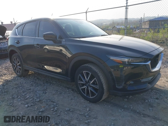 2018 Mazda CX-5 Grand Touring with VIN JM3KFBDM2J0463279, listed as a IAAI auction lot 42115309 with 68,851 mi miles. Bid and sale history available at carsss.com. Image 1.