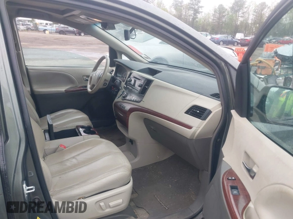 2013 Toyota Sienna XLE AAS with VIN 5TDYK3DC8DS401561, listed as a IAAI auction lot 41990044 with 214,111 mi miles and . Bid and sale history available at DreamBid. Image 5.
