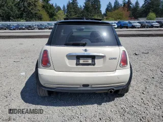 2006 MINI Hardtop with VIN WMWRC33586TJ77908, listed as a Copart auction lot 55095525 with 143,810 mi miles and Salvage title. Bid and sale history available at DreamBid. Image 6.