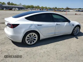 2021 Tesla Model 3 Standard Range Plus with VIN 5YJ3E1EA4MF849187, listed as a Copart auction lot 51689605 with 77,266 mi miles and Salvage Title. Bid and sale history available at carsss.com. Image 3.