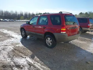 2001 Ford Escape XLS with VIN 1FMYU01171KD93513, listed as a IAAI auction lot 41767869 with 148,940 mi miles. Bid and sale history available at carsss.com. Image 3.