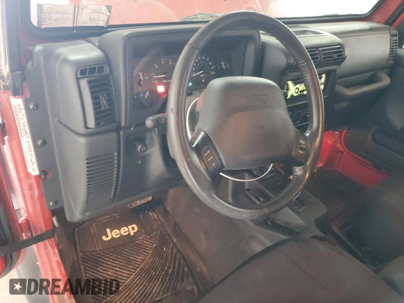 2000 Jeep Wrangler Sport with VIN 1J4FA49S9YP751596, listed as a Copart auction lot 52527315 with 132,514 mi miles and Clean Title. Bid and sale history available at carsss.com. Image 8.