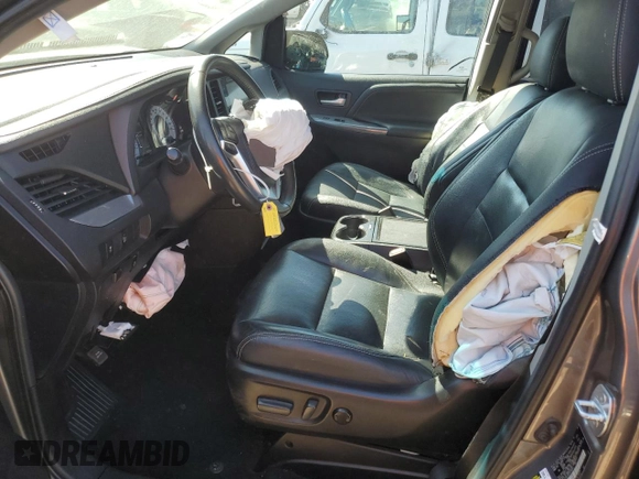 2017 Toyota Sienna SE with VIN 5TDXZ3DC5HS766941, listed as a Copart auction lot 56222045 with 94,250 mi miles and Salvage title. Bid and sale history available at DreamBid. Image 7.
