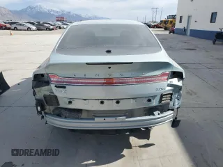 2014 Lincoln MKZ Hybrid with VIN 3LN6L2LU9ER808684, listed as a Copart auction lot 52974105 with 123,486 mi miles and Salvage Title. Bid and sale history available at DreamBid. Image 6.