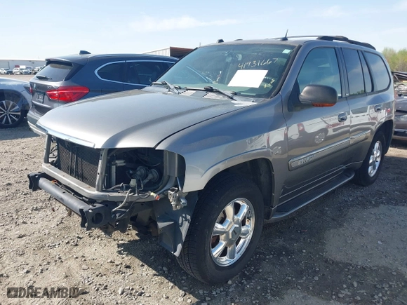 2005 GMC Envoy SLE with VIN 1GKDS13S452306939, listed as a IAAI auction lot 41931667 with 236,955 mi miles. Bid and sale history available at carsss.com. Image 18.