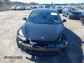 2023 Tesla Model 3 Long Range with VIN 5YJ3E1EB1PF632595, listed as a IAAI auction lot 41754131 with 8,147 mi miles and . Bid and sale history available at DreamBid. Image 12.
