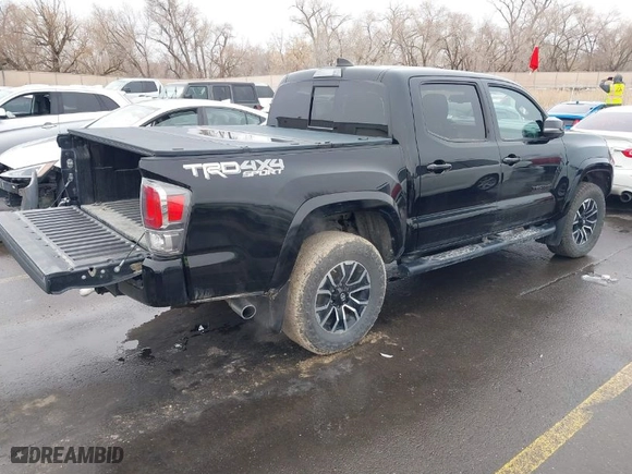 2020 Toyota Tacoma 4WD SR5 with VIN 3TMCZ5ANXLM290193, listed as a IAAI auction lot 41599730 with 40,576 mi miles. Bid and sale history available at carsss.com. Image 4.