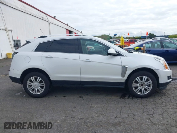 2016 Cadillac SRX Luxury Collection z VIN 3GYFNBE33GS507014, wystawiony jako IAAI lot #41979980 z przebiegiem 115 077 mil mil oraz . Historia ofert i sprzedaży dostępna na DreamBid. Obrazek 14.
