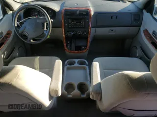 2004 Kia Sedona LX with VIN KNDUP131346508490, listed as a Copart auction lot 77391594 with 41,211 mi miles and Salvage Title. Bid and sale history available at carsss.com. Image 8.