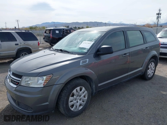 2013 Dodge Journey SE with VIN 3C4PDCAB7DT675440, listed as a IAAI auction lot 41927853 with 263,264 mi miles. Bid and sale history available at carsss.com. Image 2.