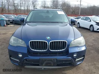 2011 BMW X5 35i with VIN 5UXZV4C56BL412415, listed as a IAAI auction lot 41611847 with 141,848 mi miles. Bid and sale history available at carsss.com. Image 12.