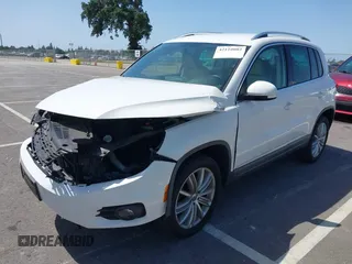 2014 Volkswagen Tiguan SEL with VIN WVGAV3AX9EW512956, listed as a IAAI auction lot 42110002 with 136,034 mi miles and . Bid and sale history available at DreamBid. Image 17.