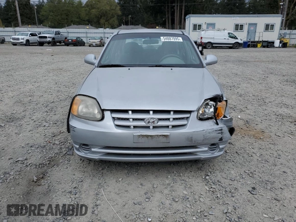 2005 Hyundai Accent GLS z VIN KMHCG45C75U639281, wystawiony jako Copart lot #54887095 z przebiegiem 136 090 mil mil oraz Szkoda całkowita • Salvage title. Historia ofert i sprzedaży dostępna na DreamBid. Obrazek 5.