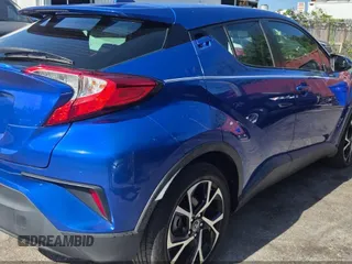 2018 Toyota C-HR XLE z VIN NMTKHMBX7JR014509, wystawiony jako IAAI lot #42375870 z przebiegiem 171 695 mil mil oraz . Historia ofert i sprzedaży dostępna na DreamBid. Obrazek 4.