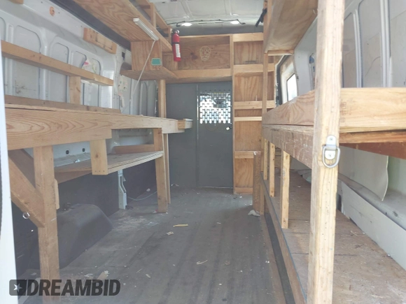 2019 Ford Transit with VIN 1FTBW3XG2KKA66858, listed as a IAAI auction lot 41969887 with 140,304 mi miles and . Bid and sale history available at DreamBid. Image 8.