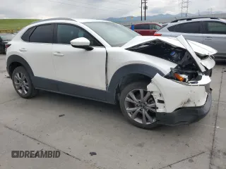 2022 Mazda CX-30 S Select with VIN 3MVDMBBL9NM411859, listed as a Copart auction lot 59875745 with 52,878 mi miles and Salvage title. Bid and sale history available at DreamBid. Image 4.
