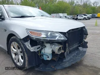 2012 Ford Taurus SEL z VIN 1FAHP2EW1CG134363, wystawiony jako IAAI lot #42180692 z przebiegiem 163 193 mil mil oraz . Historia ofert i sprzedaży dostępna na DreamBid. Obrazek 12.
