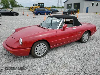 1991 Alfa Romeo Spider z VIN ZARBB32NXM6004773, wystawiony jako Copart lot #58573415 z przebiegiem 94 966 mil mil oraz Szkoda całkowita • Salvage title. Historia ofert i sprzedaży dostępna na DreamBid. Obrazek 1.