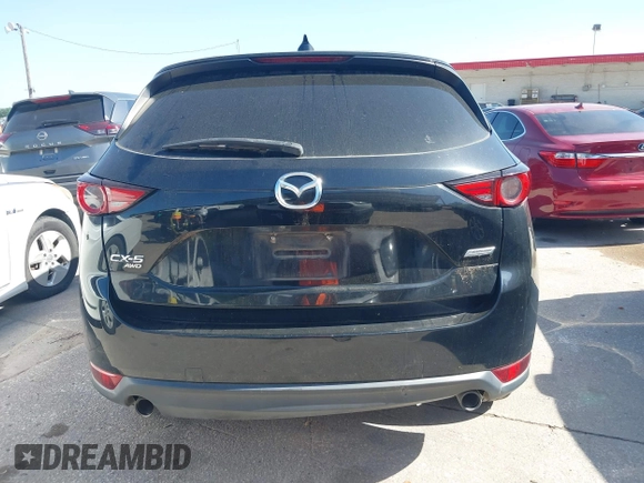 2019 Mazda CX-5 Grand Touring with VIN JM3KFBDM2K0564047, listed as a IAAI auction lot 42000455 with 152,590 mi miles and . Bid and sale history available at carsss.com. Image 16.