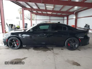 2019 Dodge Charger SRT Hellcat with VIN 2C3CDXL97KH552439, listed as a IAAI auction lot 41813879 with 58,921 mi miles and . Bid and sale history available at DreamBid. Image 14.