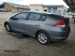 2011 Honda Insight EX with VIN JHMZE2H77BS006079, listed as a Copart auction lot 63873985 with 134,159 mi miles and Salvage title. Bid and sale history available at DreamBid. Image 2.