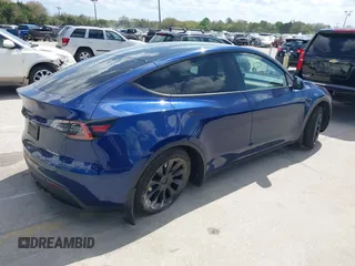 2023 Tesla Model Y Long Range with VIN 7SAYGDEE9PA205757, listed as a IAAI auction lot 41705881 with 18,567 mi miles and . Bid and sale history available at carsss.com. Image 4.