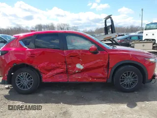 2021 Mazda CX-5 Touring z VIN JM3KFBCM1M0401717, wystawiony jako IAAI lot #42036407 z przebiegiem 35 587 mil mil oraz . Historia ofert i sprzedaży dostępna na DreamBid. Obrazek 13.