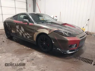 2008 Hyundai Tiburon GS z VIN KMHHM66D68U283198, wystawiony jako IAAI lot #41670867 z przebiegiem 60 255 mil mil oraz . Historia ofert i sprzedaży dostępna na DreamBid. Obrazek 1.