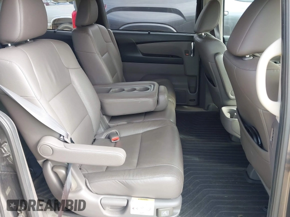 2015 Honda Odyssey Touring Elite z VIN 5FNRL5H97FB060981, wystawiony jako IAAI lot #42289631 z przebiegiem 160 947 mil mil oraz . Historia ofert i sprzedaży dostępna na DreamBid. Obrazek 8.