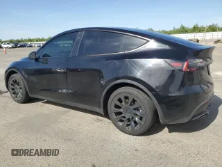 2024 Tesla Model Y with VIN 7SAYGDED0RF131495, listed as a Copart auction lot 56849765 with 10,120 mi miles and Salvage title. Bid and sale history available at DreamBid. Image 2.