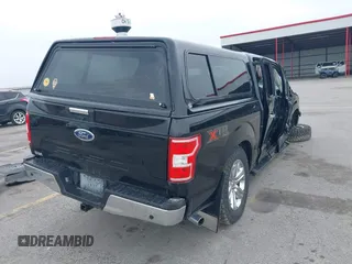 2018 Ford F-150 XL with VIN 1FTEW1E5XJKC37082, listed as a IAAI auction lot 42335721 with 167,401 mi miles and . Bid and sale history available at DreamBid. Image 4.