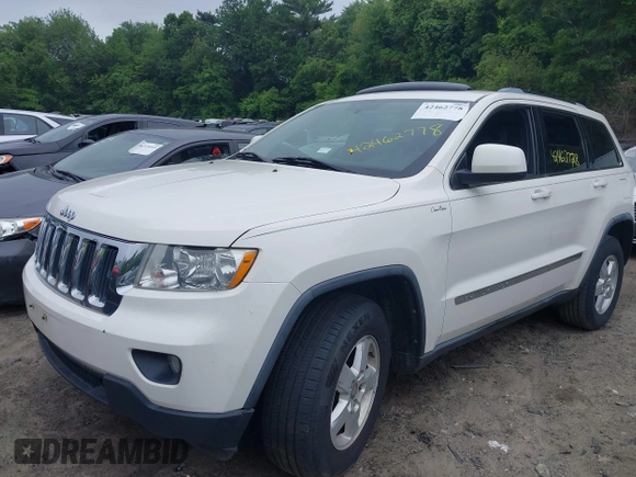 2011 Jeep Grand Cherokee Laredo with VIN 1J4RR4GG0BC670506, listed as a IAAI auction lot 42462778 with 241,406 mi miles and . Bid and sale history available at DreamBid. Image 2.
