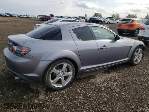 2005 Mazda RX-8 with VIN JM1FE173050145886, listed as a Copart auction lot 71110404 with 66,894 mi miles and Salvage Title. Bid and sale history available at carsss.com. Image 3.