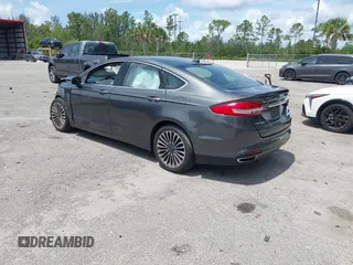 2018 Ford Fusion Titanium with VIN 3FA6P0D9XJR169657, listed as a IAAI auction lot 42392112 with 62,754 mi miles and . Bid and sale history available at DreamBid. Image 3.