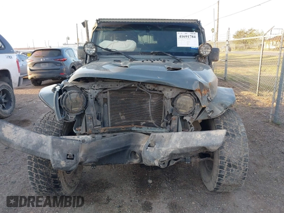 2014 Jeep Wrangler Sport with VIN 1C4AJWAG0EL326774, listed as a IAAI auction lot 41691784 with 98,696 mi miles and . Bid and sale history available at DreamBid. Image 13.