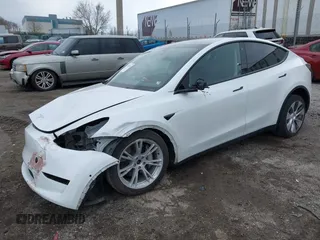 2022 Tesla Model Y Long Range with VIN 7SAYGAEE4NF516625, listed as a IAAI auction lot 41892225 with 33,054 mi miles and . Bid and sale history available at DreamBid. Image 2.