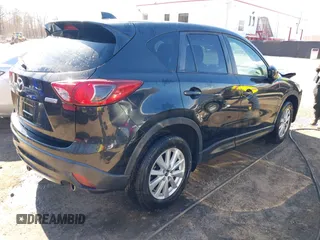 2013 Mazda CX-5 Touring with VIN JM3KE2CE3D0105660, listed as a IAAI auction lot 41876399 with 156,618 mi miles. Bid and sale history available at carsss.com. Image 4.
