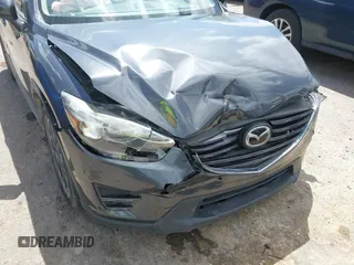 2016 Mazda CX-5 Grand Touring with VIN JM3KE4DY7G0643643, listed as a IAAI auction lot 42077497 with 120,343 mi miles and . Bid and sale history available at carsss.com. Image 17.