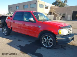 2001 Ford F-150 SuperCrew XLT with VIN 1FTRW07L21KC02219, listed as a IAAI auction lot 41366011 with 221,522 mi miles. Bid and sale history available at carsss.com. Image 1.