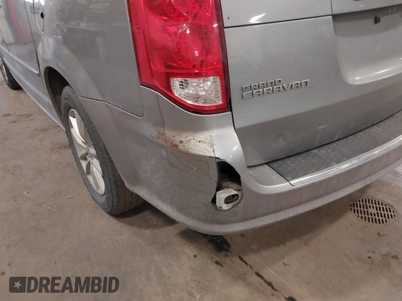 2014 Dodge Grand Caravan SXT with VIN 2C4RDGCG9ER213426, listed as a IAAI auction lot 41044553 with 175,140 mi miles and . Bid and sale history available at DreamBid. Image 6.