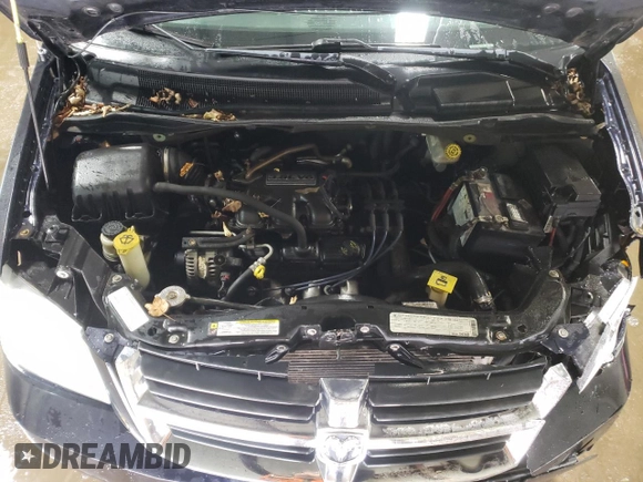 2010 Dodge Grand Caravan SXT with VIN 2D4RN5D15AR140564, listed as a Copart auction lot 52735825 with 187,744 mi miles and Salvage Title. Bid and sale history available at DreamBid. Image 12.