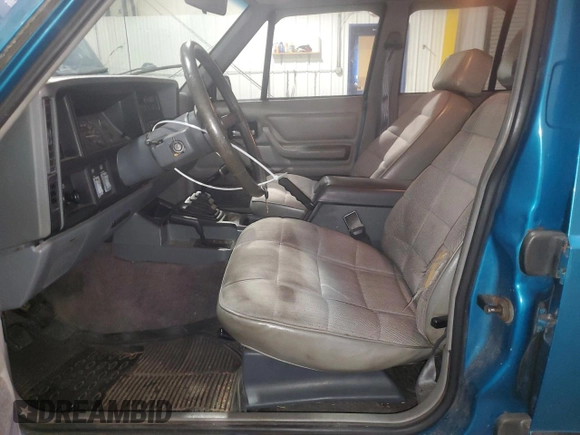 1994 Jeep Cherokee Sport with VIN 1J4FJ68S5RL109124, listed as a Copart auction lot 85524644 with 369,388 mi miles and Salvage title. Bid and sale history available at DreamBid. Image 7.