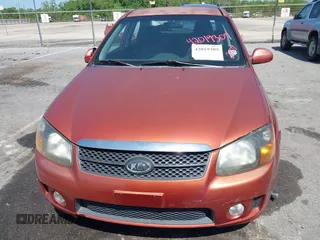 2009 Kia Spectra EX with VIN KNAFE221195026956, listed as a IAAI auction lot 42019309 with 121,341 mi miles. Bid and sale history available at carsss.com. Image 6.