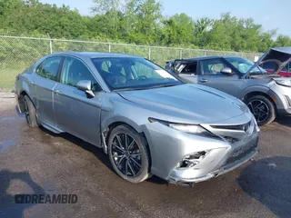 2021 Toyota Camry SE Nightshade with VIN 4T1G11AKXMU599663, listed as a IAAI auction lot 41902392 with 76,909 mi miles. Bid and sale history available at carsss.com. Image 1.