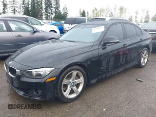 2013 BMW 3 Series 328i xDrive with VIN WBA3B5C56DJ599110, listed as a IAAI auction lot 41960292 with 120,224 mi miles. Bid and sale history available at carsss.com. Image 2.