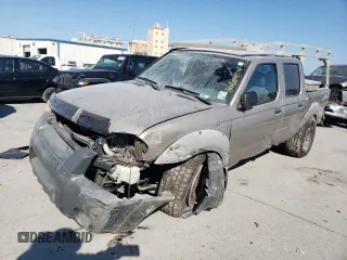 2002 Nissan Frontier SE with VIN 1N6ED27T52C383700, listed as a Copart auction lot 86204074 with 216,908 mi miles and Salvage title. Bid and sale history available at DreamBid. Image 1.