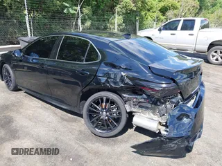 2022 Toyota Camry TRD with VIN 4T1KZ1AK2NU064511, listed as a IAAI auction lot 42176608 with 28,064 mi miles and . Bid and sale history available at DreamBid. Image 3.