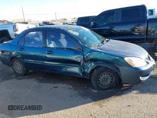 2005 Mitsubishi Lancer ES with VIN JA3AJ26E65U014838, listed as a IAAI auction lot 41310586 with 127,487 mi miles. Bid and sale history available at carsss.com. Image 13.